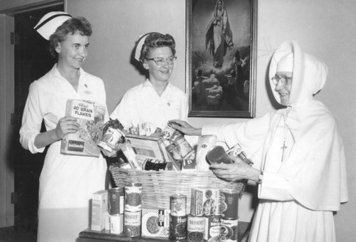Nun and nurses fill Christmas baskets at St. Joseph Hospital