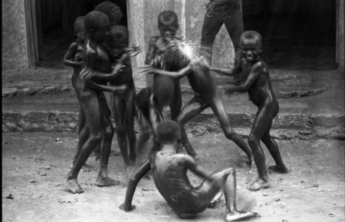 Children play under the rain, San Basilio de Palenque, 1975