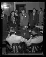 Actress Hedy LaMarr and John Loder in courtroom, confronting men suspected of robbing their house in Los Angeles, Calif., 1946