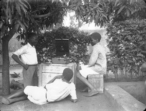 African boys listening to a phonograph, Maputo, Mozambique, 1933