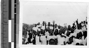 Portrait of a group of boys standing outside on a hill, Africa, May 1947