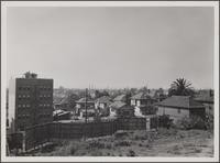 Looking south from 7th Street; parking place between Francisco and Bixel Streets, apartment house in foreground