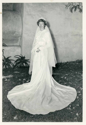Outdoor photograph of the new Mrs. Humfreville in her wedding gown