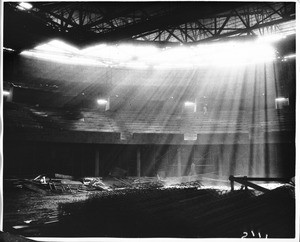 Rays of sunshine coming into the construction pit, Los Angeles Memorial Sports Arena, 1959
