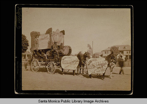 Santa Monica real estate auction advertisement worn by horses pulling a promotional wagon