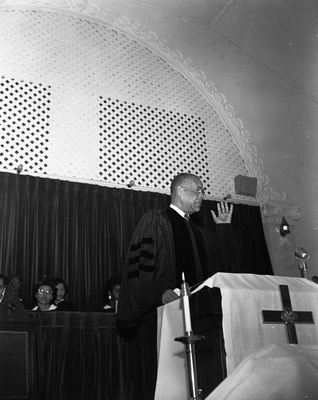 Earl Grant speaking at pulpit