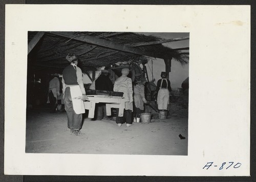 Adobe factory. Women workers carrying adobe frames to the mixing tables. Photographer: Stewart, Francis Poston, Arizona