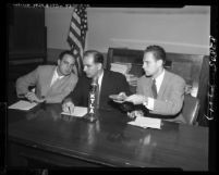 Senator Joseph McCarthy seated with Ray M. Cohn and G. David Schine during committee inquiry, 1953