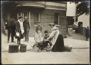 Woman cooking in Fillmore Street after the earthquake, San Francisco, 1906