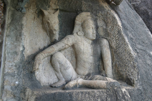 Isurumuniya, rock temple: north of shrine: sculpture of seated man and a horse: Kapila