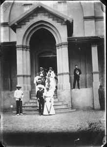 Procession of bridal couples coming out of the chapel in Khovo, Maputo, Mozambique, ca. 1902-1914