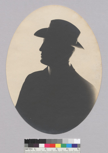 Bust length silhouette of man wearing hat, Bohemian Grove. [photographic print]