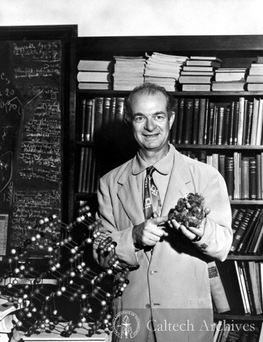 Linus Pauling with model and sample of beryl silicate