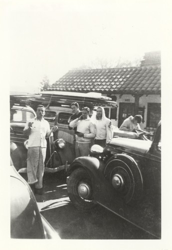 Claude "Duke" Horan, "Jeep" Allen, Charley Frans, P. B. Smith "Smitty" in front of Father Devine's Restaurant corner of Front and Laurel Streets