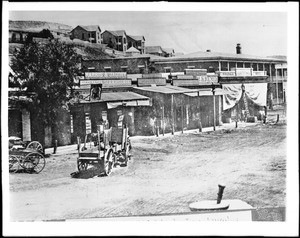 Main Street looking north from Temple Street on the northwest corner, showing the old Downy Block, Los Angeles, ca.1878