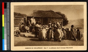 Priest preaching to a group of people outside a cottage, South Africa, ca.1920-1940