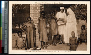 Missionary sister and indigenous nurse bandage wounds, Niangara, Congo, ca.1900-1930