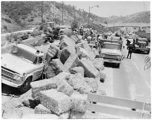 Hay truck accident on freeway, 1959