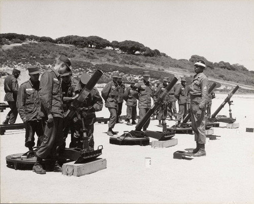 Photograph of soldiers being trained to use mortars