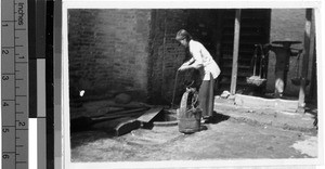 Woman washing clothes in a well, Wuchow, China, May 1948