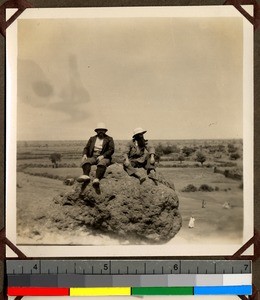 Two priests sitting on a rock, Kano, Nigeria, 1923