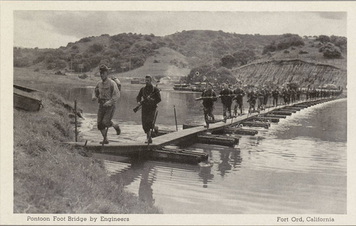 Photographic postcard of pontoon footbridge