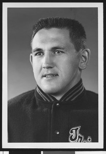 University of Southern California football line coach Don Clark, studio shot in letter jacket, 1951
