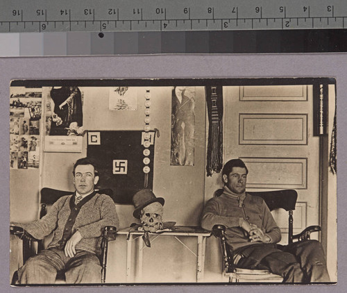 Two unidentified men in a cabin or room