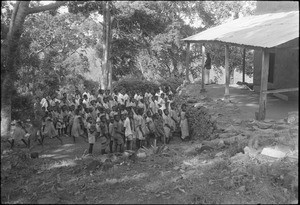Pupils waiting in front of their school