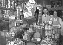 Fleming's Market at 108 North Main Street Sebastopol with manager Vern Chaney and Edith Cruz, 1930s