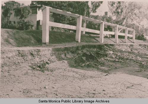 Damaged barrier on Via de Las Olas at the top of the 1958 killer landslide zone