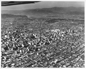 Aerial view of downtown Los Angeles looking north and west from the vicinity of San Pedro Avenue and Olympic Avenues