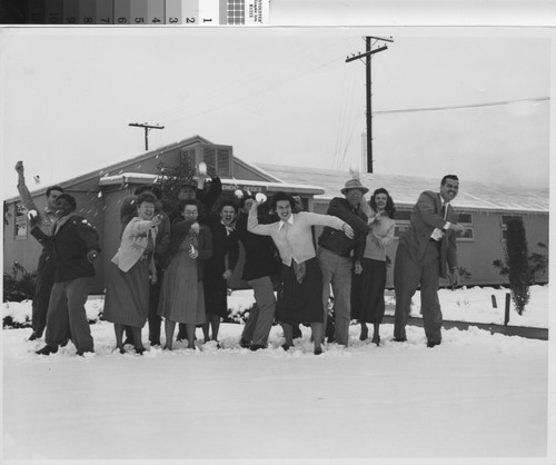 Photograph of a group playing in the snow at Basilone Homes