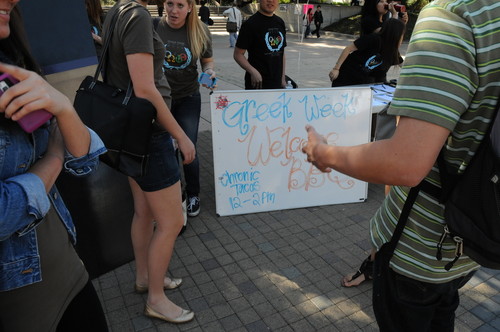 Greek Week Welcome BBQ information table on the Ring Mall; photograph at University of California, Irvine