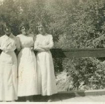 Three ladies on a bridge