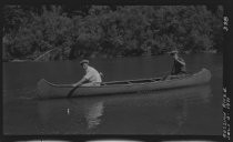 Two people in canoe on Russian River, 1921