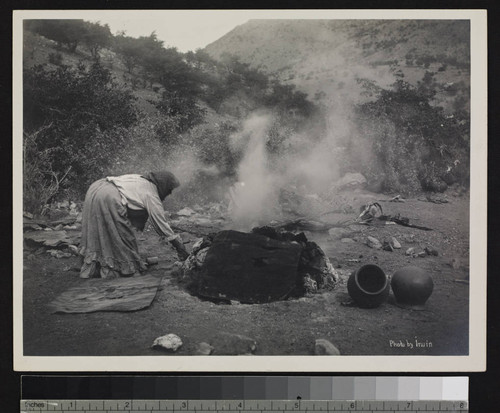 Papago Indian woman using oven for pottery. Near Bisbee, Arizona