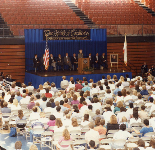 Mrs. Flora Thornton speaking at the Convocation, the audience in the foreground
