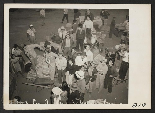 Los Angeles, Calif.--Evacuees of Japanese ancestry entraining for Manzanar, Calif., 250 miles away, where they now are housed in a War Relocation Authority center. Photographer: Albers, Clem Los Angeles, California