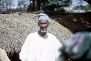 Fulani man and straw roof, Cameroon, 1953-1968