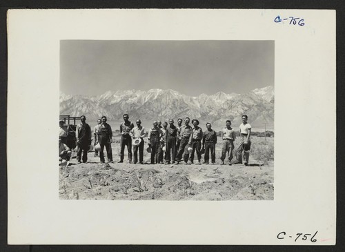 Manzanar, Calif.--Farm crew of which Johnny Fukazawa is foreman. These men are ready to return to the center's mess hall for lunch after a busy morning in the fields of the farm project at this War Relocation Authority Center. Photographer: Lange, Dorothea Manzanar, California