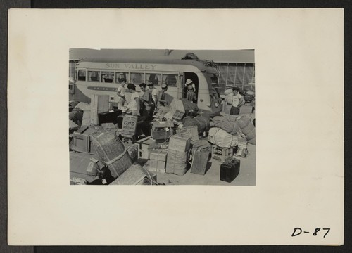 Eden, Idaho--Baggage, belonging to evacuees who have just arrived from the assembly center at Puyallup, Washington, is sorted and trucked to owners in their barrack apartments. Photographer: Stewart, Francis Hunt, Idaho