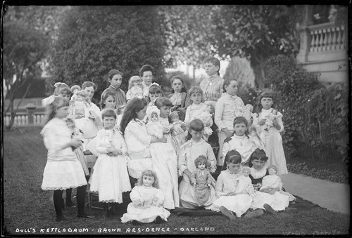 Group portrait of children at doll tea party, Roland G. Brown residence, Oakland. [negative]