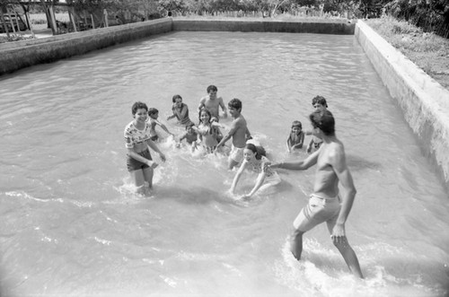 Young people in a pool, La Guajira, Colombia, 1976