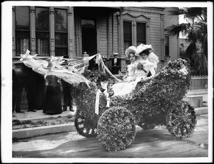 Miss Heron and Miss Clark in one of the first automobiles used in La Fiesta parade, Los Angeles, ca.1901-1907