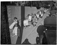 Women and children picket outside of the Works Progress Administration during a sit-down strike, Los Angeles, 1936