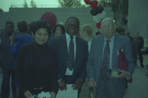 Peter Drucker standing next to two individuals