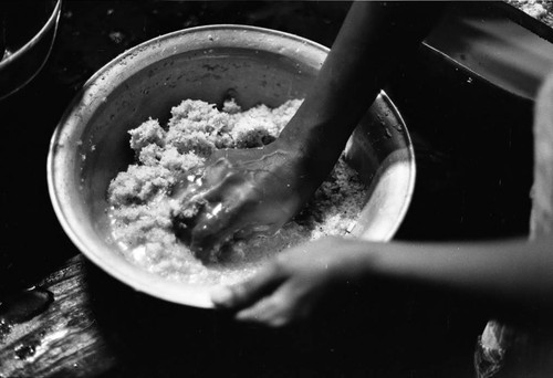 Woman preparing mashed coconut, San Basilio de Palenque, 1977