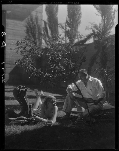 R. Lee Miller and Mrs. Jack Pfister in a patio, Palm Springs
