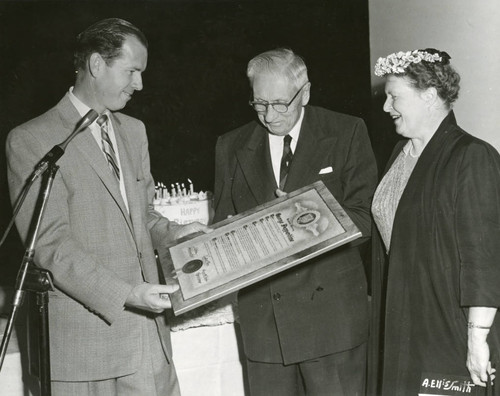 Kenneth Hahn presenting George Pepperdine with plaque
